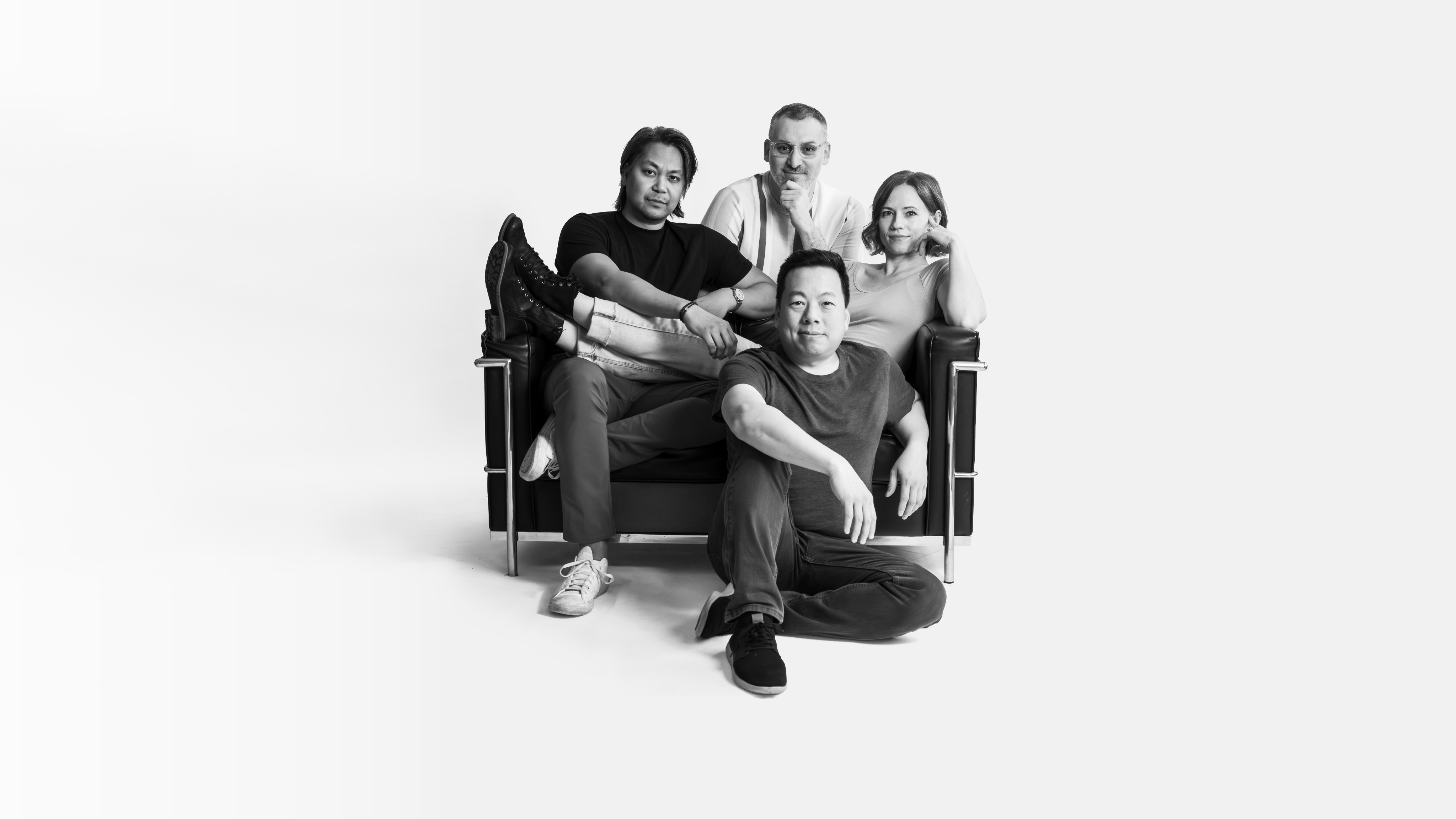 Owners and employees of traceablechnage sitting on a black couch