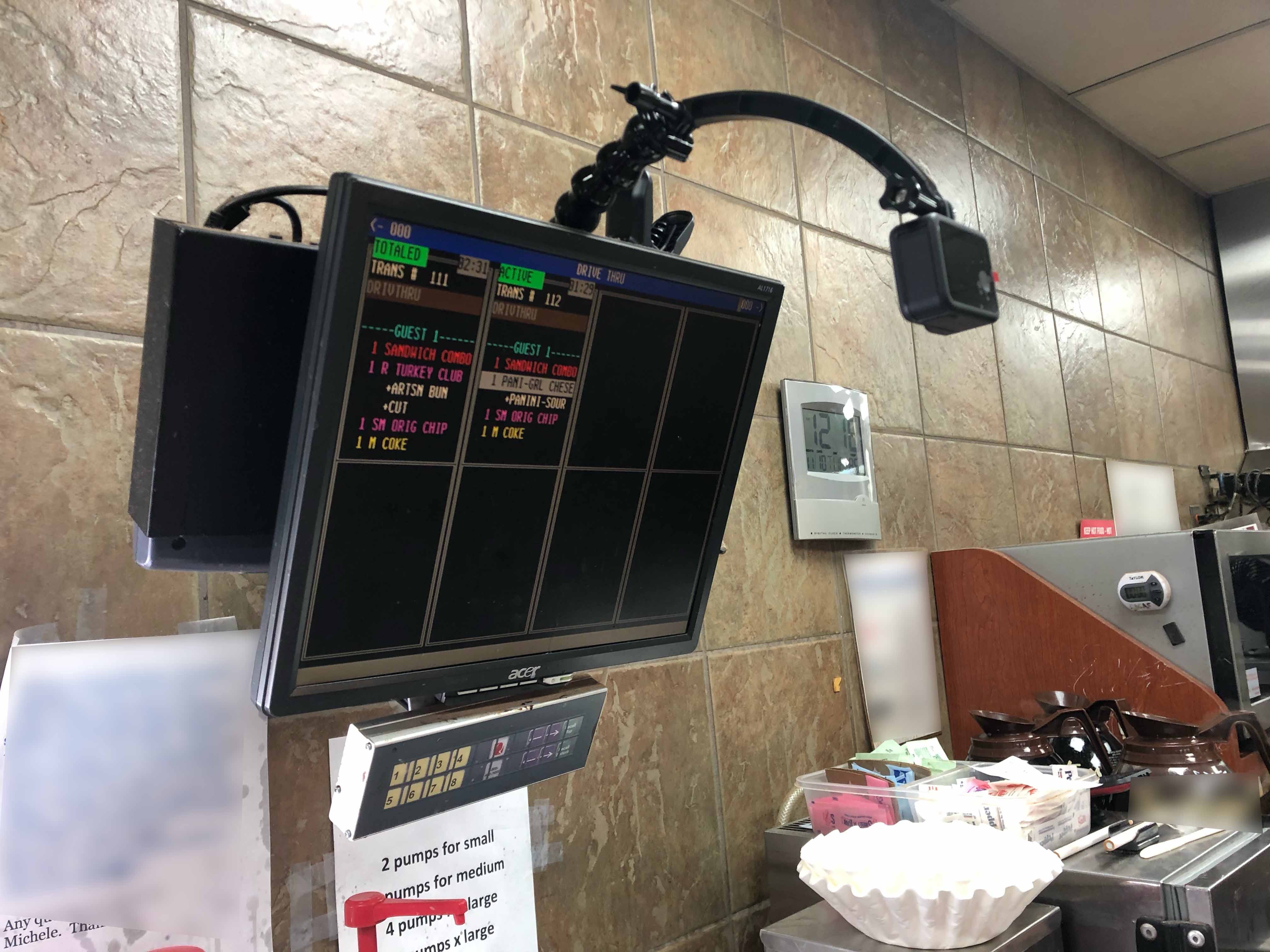 Kitchen order monitor with observation camera setup